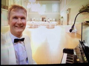 playing the piano at a wedding event.